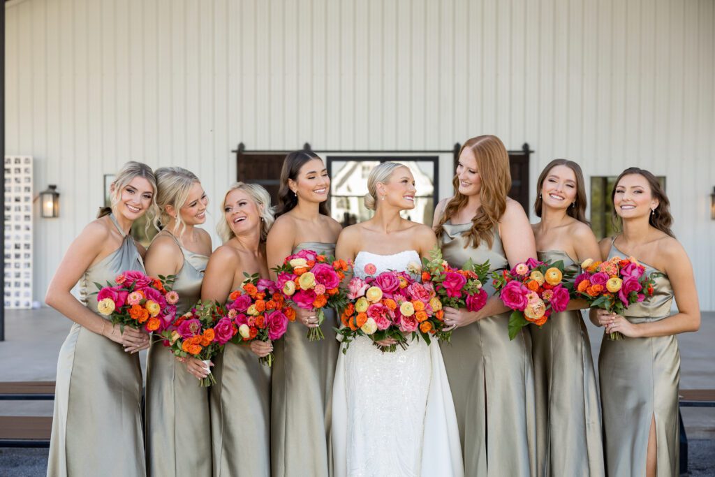 a group of women holding flowers