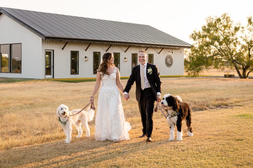 a man and woman in wedding dress walking dogs , 8 Tips for Incorporating Pets into Your Wedding Photos