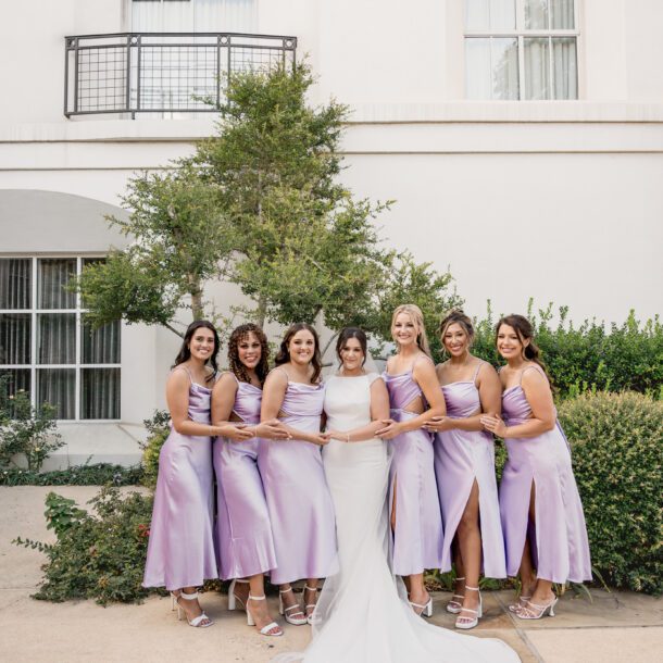 Bride with her bridesmaids during wedding portraits at La Cantera Resort in San Antonio photographed by Bushel + Peck Photo.