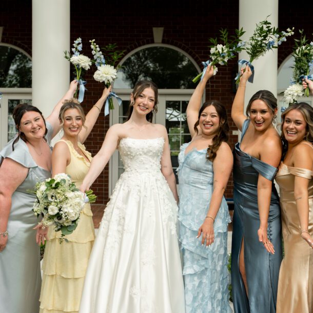 Bride and bridesmaids celebrating in front of The Mansion at ColoVista photographed by Bushel + Peck Photo.