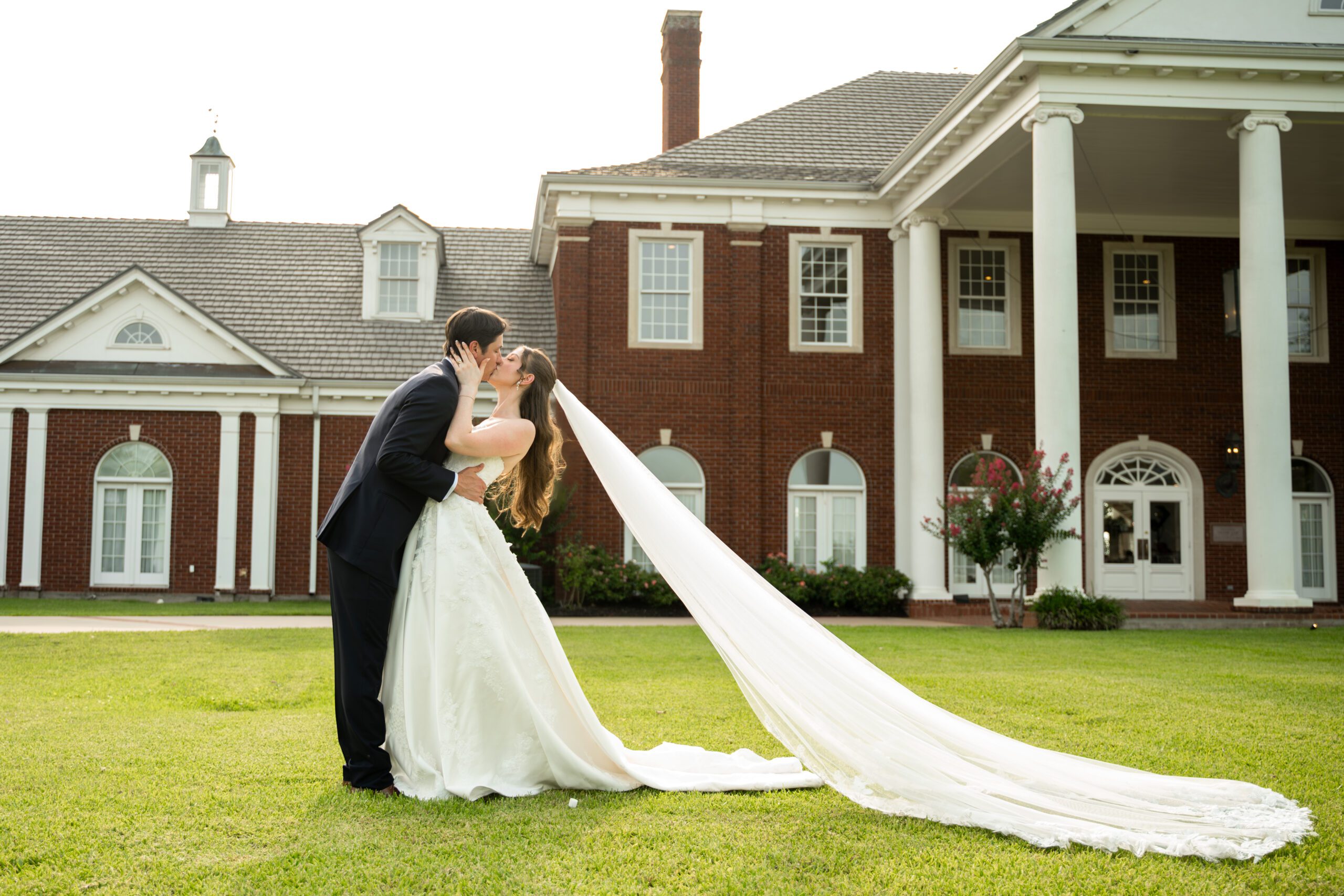 Bride and groom share a kiss at the Mansion at Colovista, photographed by Bushel + Peck Photo