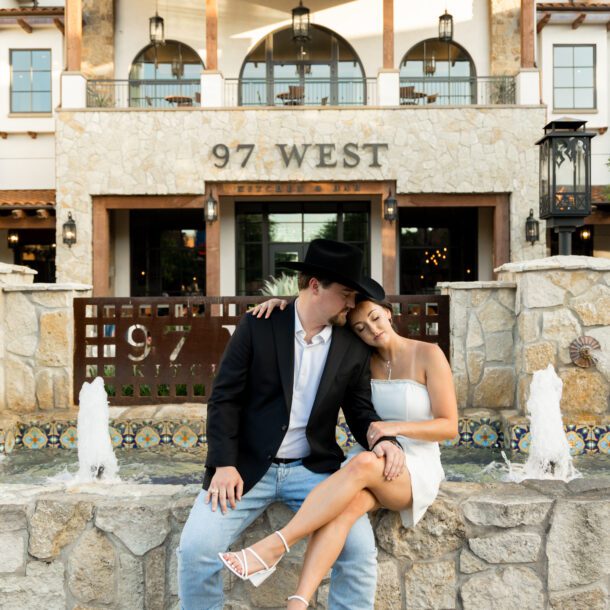 Couple at the fountain in front of Hotel Drover in the Fort Worth Stockyards — Bushel + Peck Photo Fort Worth wedding photographer