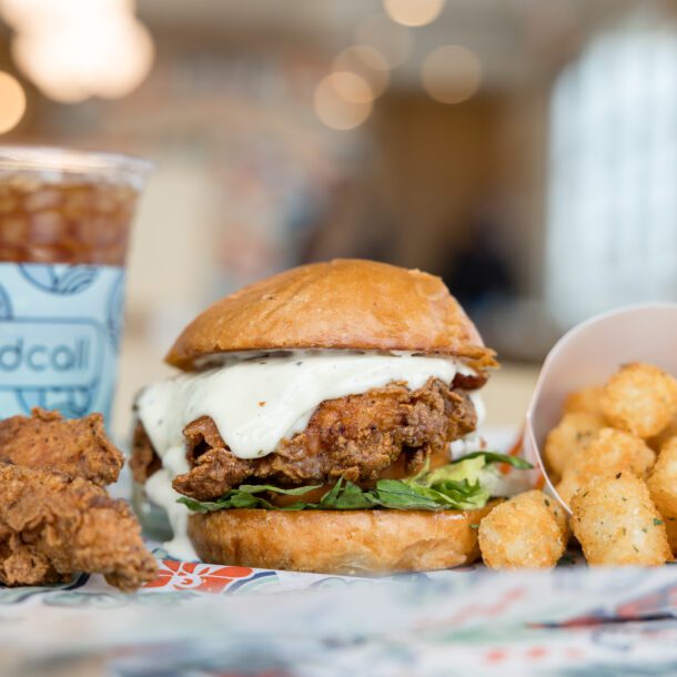 Birdcall fried chicken sandwich, tenders, tots and sweet tea styled for brand photography, captured by Bushel + Peck Photo.