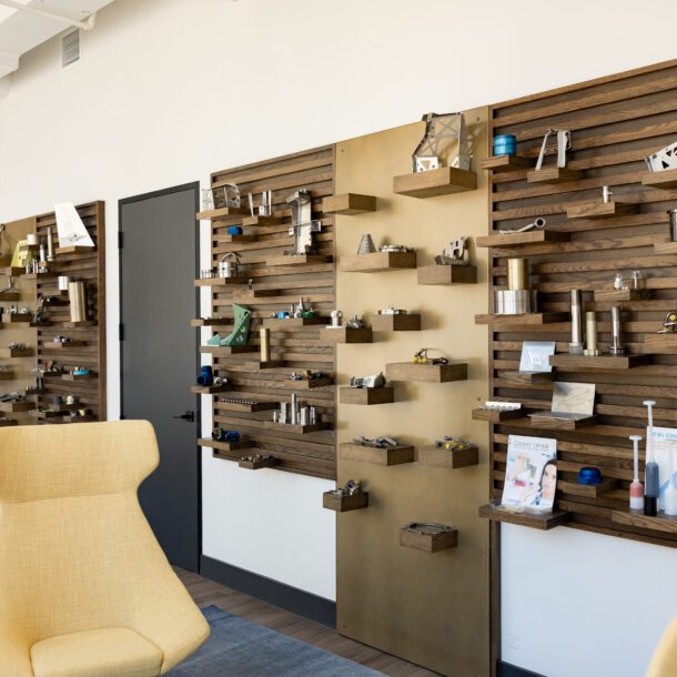 Product display wall inside Novaria Group's Fort Worth headquarters, captured by Bushel + Peck Photo.