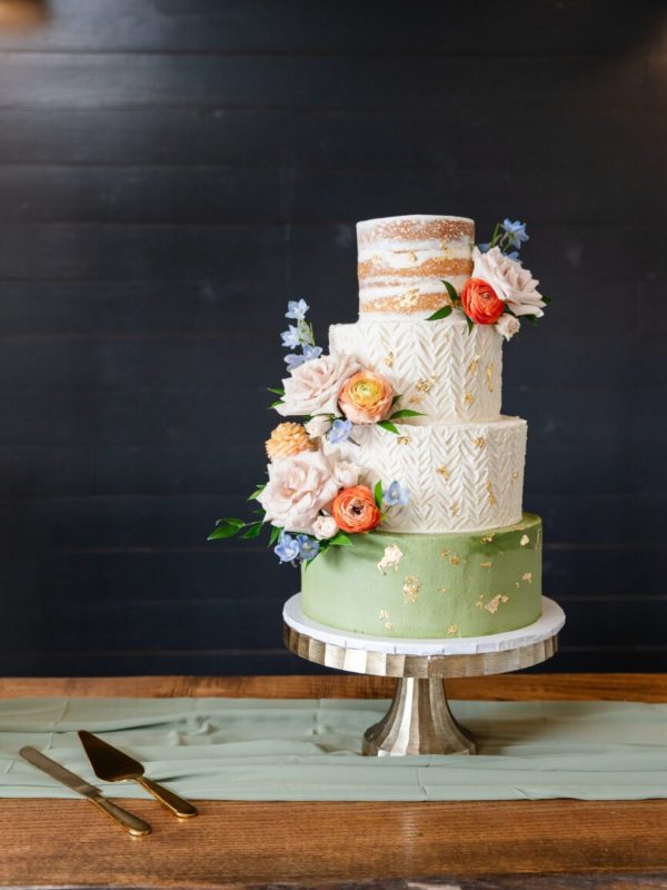 Tiered wedding cake with fresh florals at Davis & Grey Farms, captured by Bushel + Peck Photo