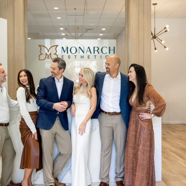Team branding photo at Monarch Esthetic with smiling professionals — corporate photography by Bushel + Peck Photo.